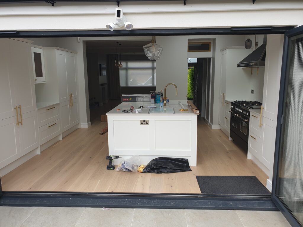 Kitchen refurbishment featuring a central island in Loughton