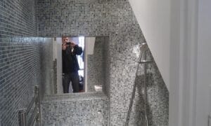 Bespoke tiled shower niche and bathroom installation detail