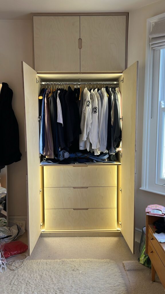 Custom wardrobe interior with hanging space and storage drawers