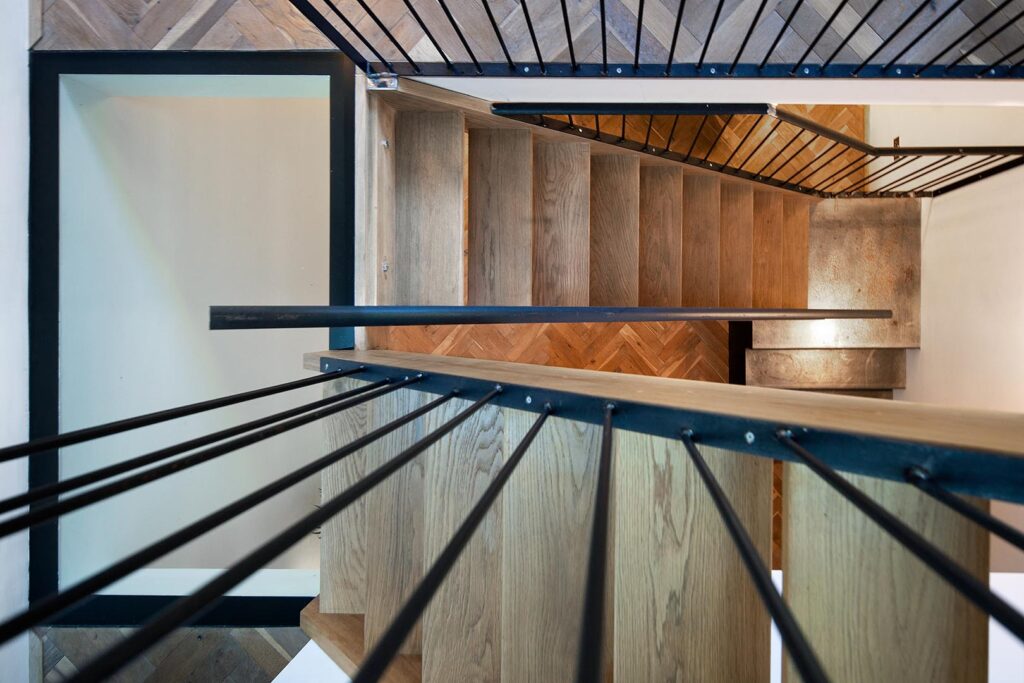 Bespoke oak staircase installation with metal balustrade in Brentwood